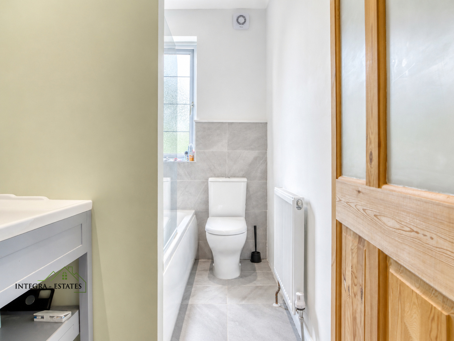 Thorpe close Sydenham SE26 modern light fitted bathroom filled with light and modern decor.