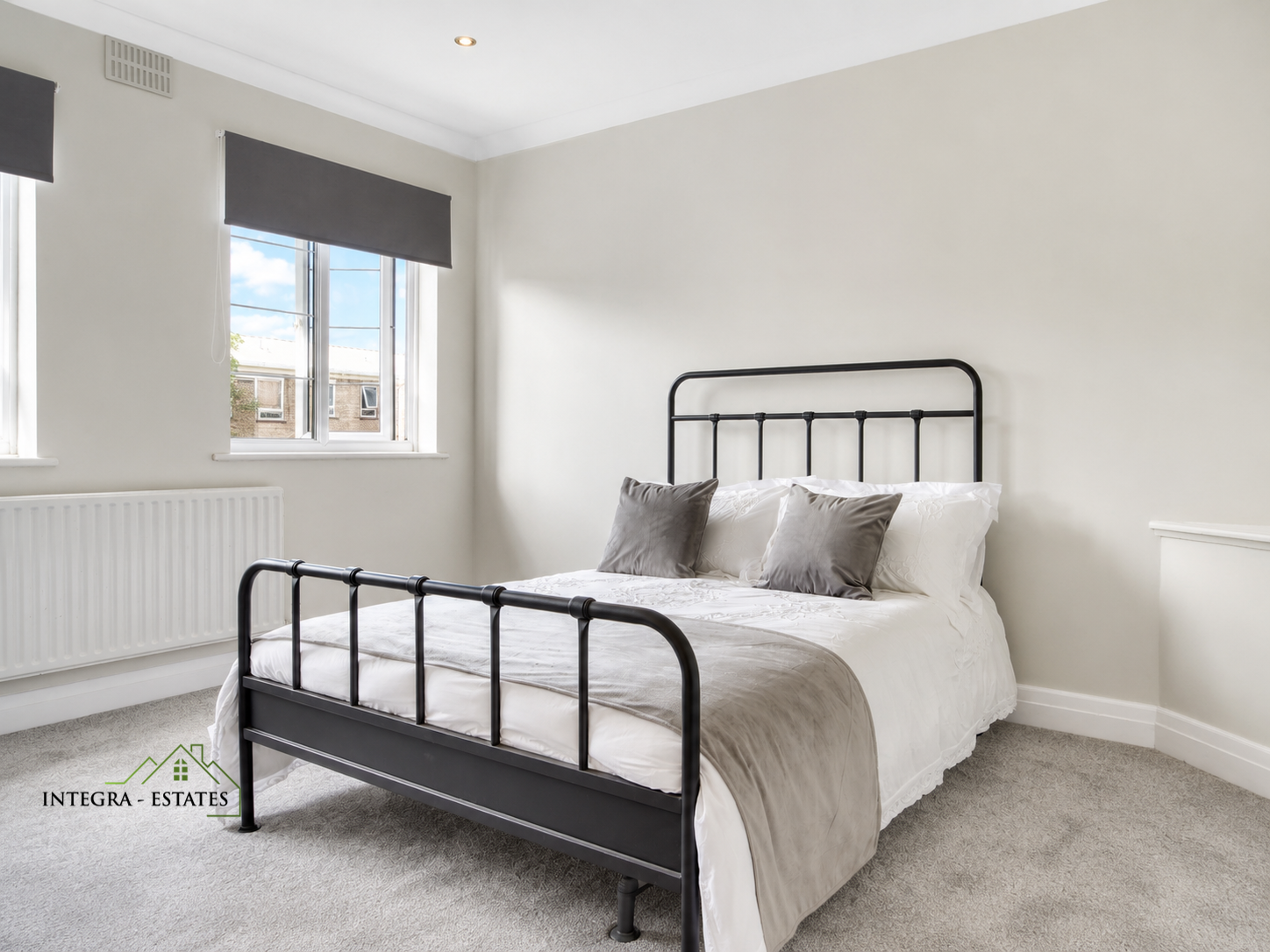 Modern double bedroom thorpe close Sydenham SE26 with modern bed, flooring and decor.